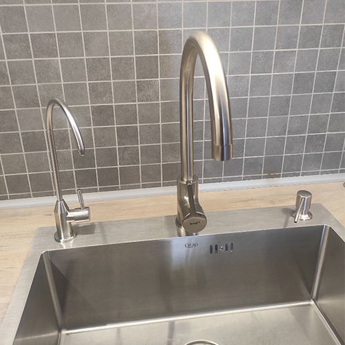 separate filtered water tap installed on countertop, with existing cold and hot mixer tap.