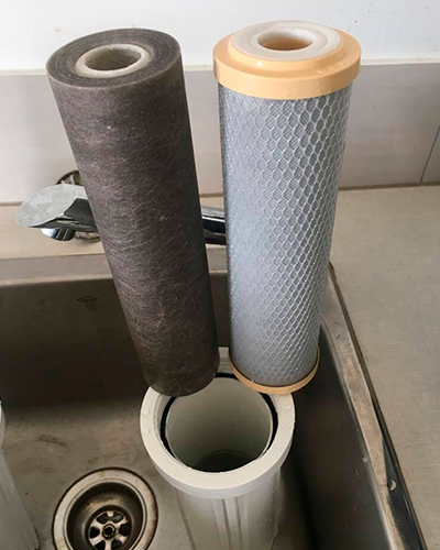 Used sediment filter, dirty with sand and particles on filter.